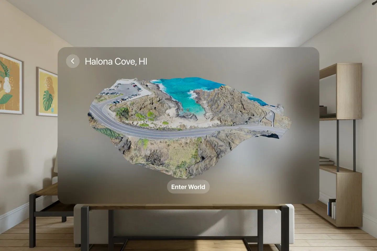 Design mockup of a visionOS window in a living room showing a textured 3D scan of Halona Cove floating as an object, with a button reading Enter World